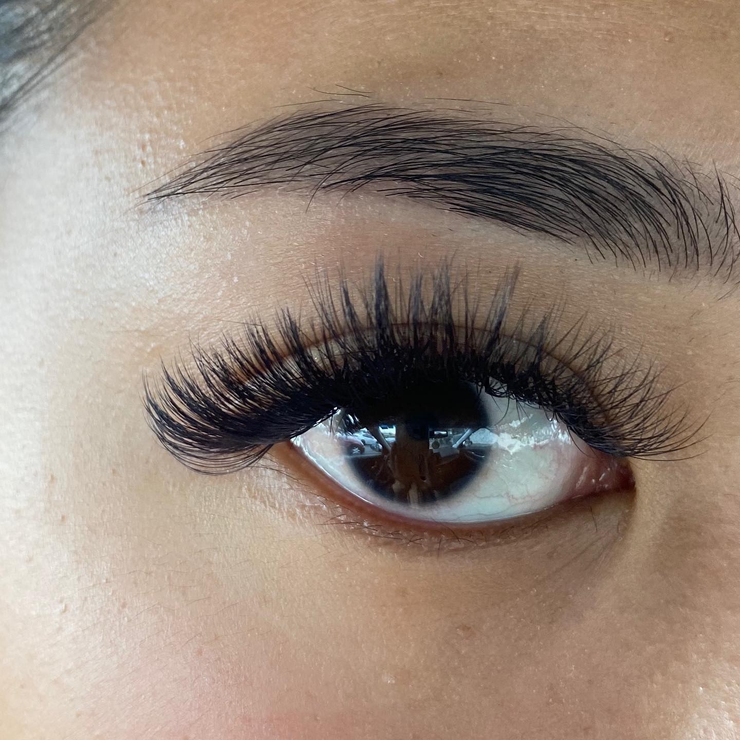 Wispy lashes with a groomed brow
