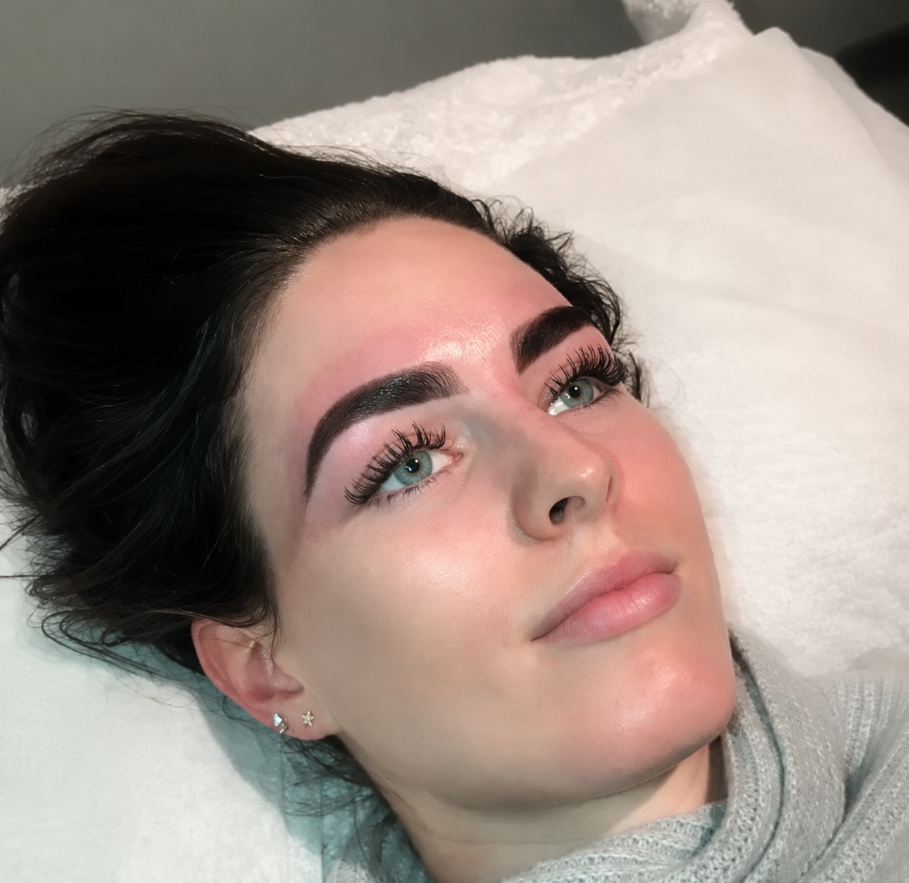A client with freshly done lashes and brows
